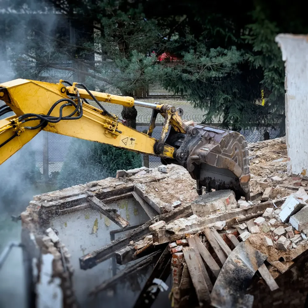 Worker monitoring vibration during demolition