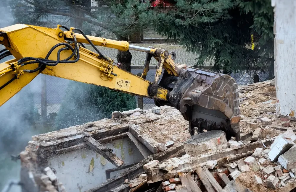 Worker monitoring vibration during demolition